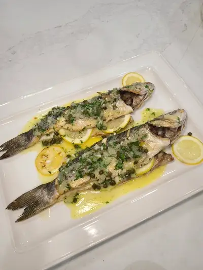 Whole roasted fish with lemon-caper butter, a showstopper main course by Nashville private chef Mollie