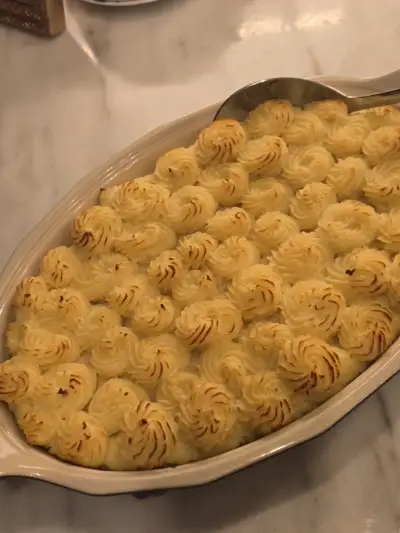 Shepherd's pie with beautifully piped potato rosettes — elevated comfort food by Chef Mollie Nashville